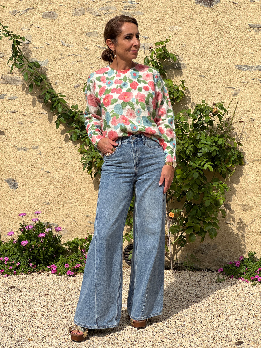 LIOR floral sweater in pink, yellow and sky blue on a beige background In April 1986