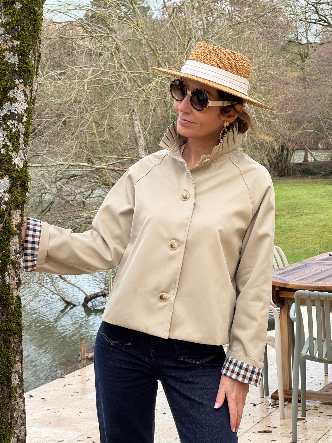 Short beige trench coat with stand-up collar and navy and chocolate gingham detailing OLIVIA