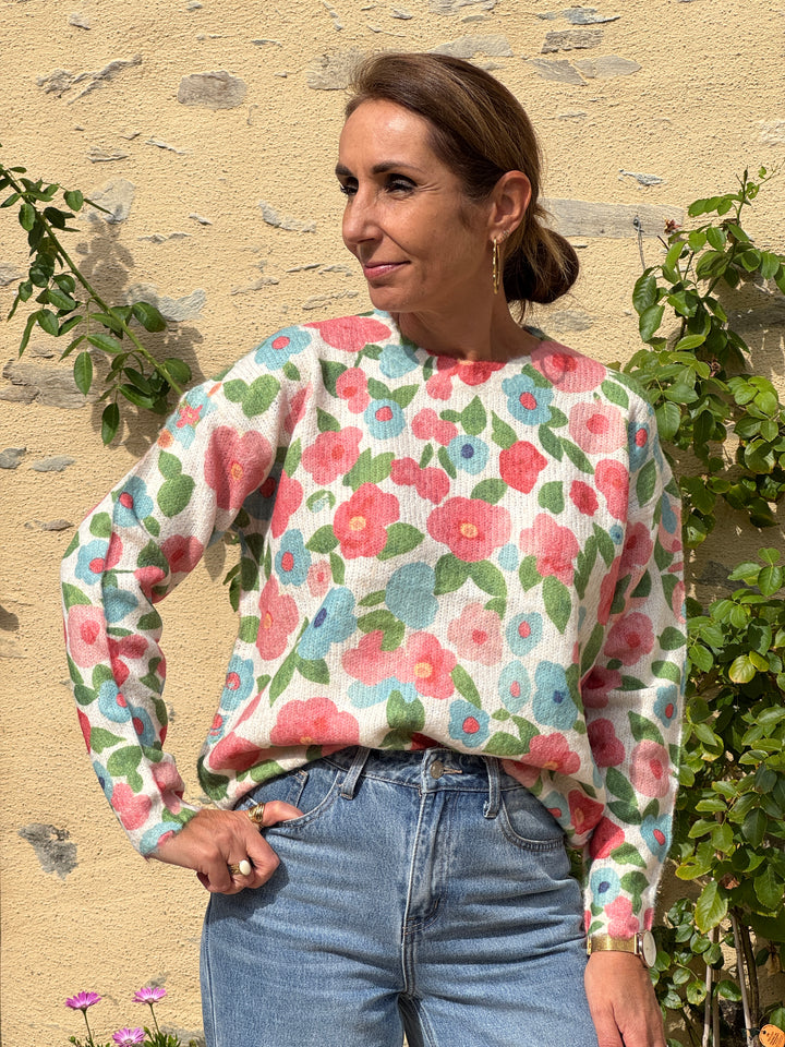 LIOR floral sweater in pink, yellow and sky blue on a beige background In April 1986