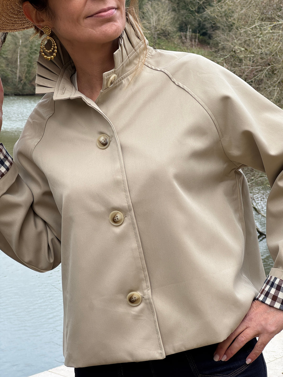 Short beige trench coat with stand-up collar and navy and chocolate gingham detailing OLIVIA