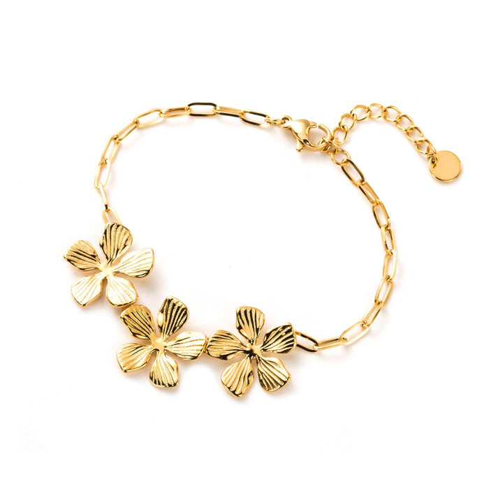 Bracelet doré en acier inoxydable avec trois fleurs élégantes sur chaîne fine, bijou hypoallergénique résistant à l’eau