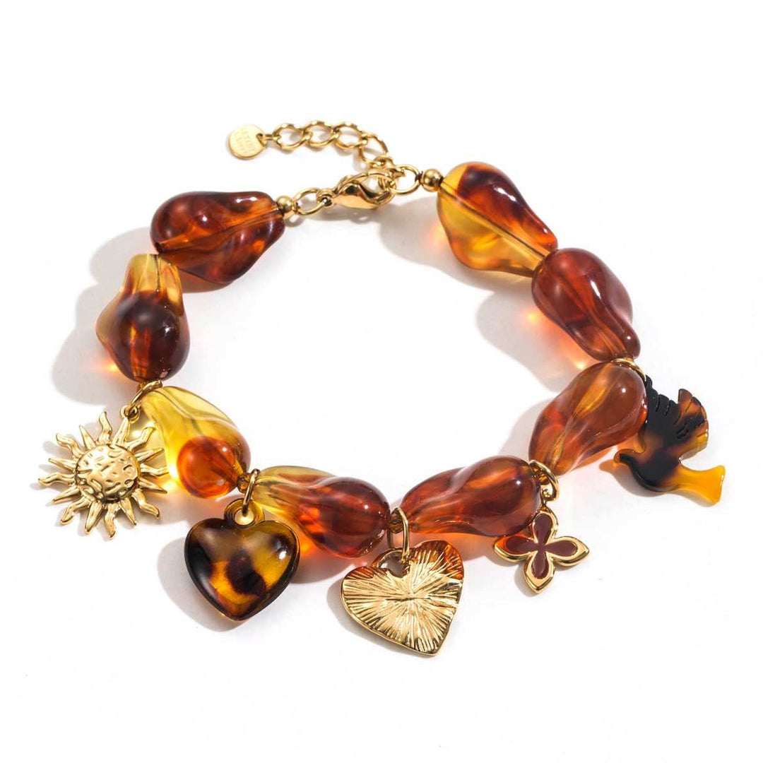 Bracelet ambre charms en résine effet ambre avec breloques dorées, acier inoxydable réglable