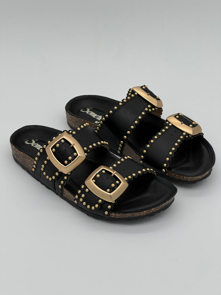 Mules noires Semerdjian en cuir lisse avec double bride et détails clous dorés, légères et confortables pour un look tendance au quotidien