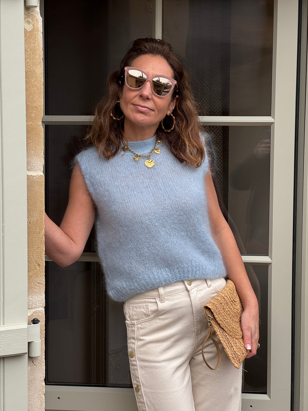 Pull sans manches femme bleu ciel col rond en maille douce idéal pour la mi-saison